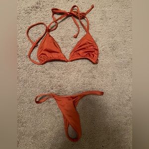 CSB shiny dark orange thong bikini top and bottoms in size XS.